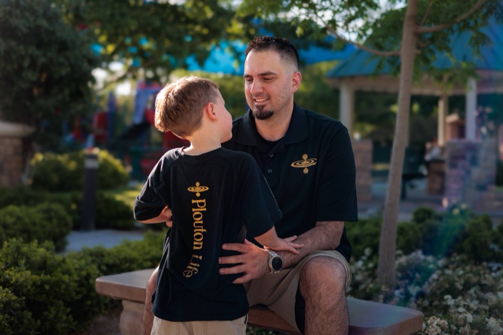Pete Foldes and his son Cy in matching Plouton Life shirts
